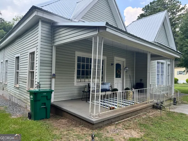 a front view of a house with a porch