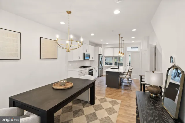 a bedroom with a large bed and a large window