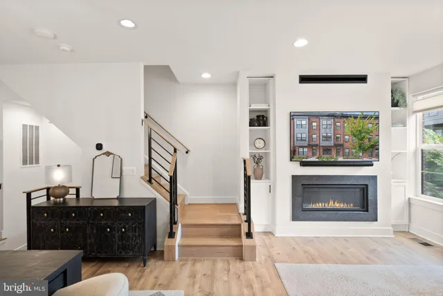 a bathroom with a shower sink and mirror