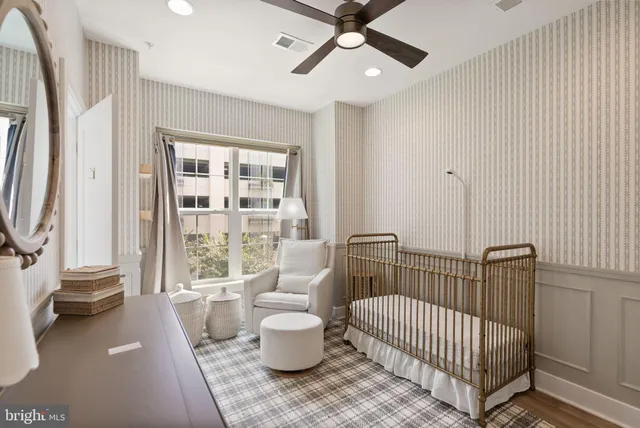 a living room with furniture and a night stand