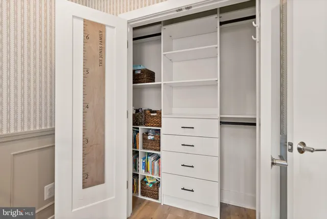 a bedroom with a bed and a television