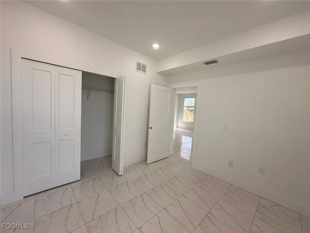 a view of kitchen with windows and chandelier