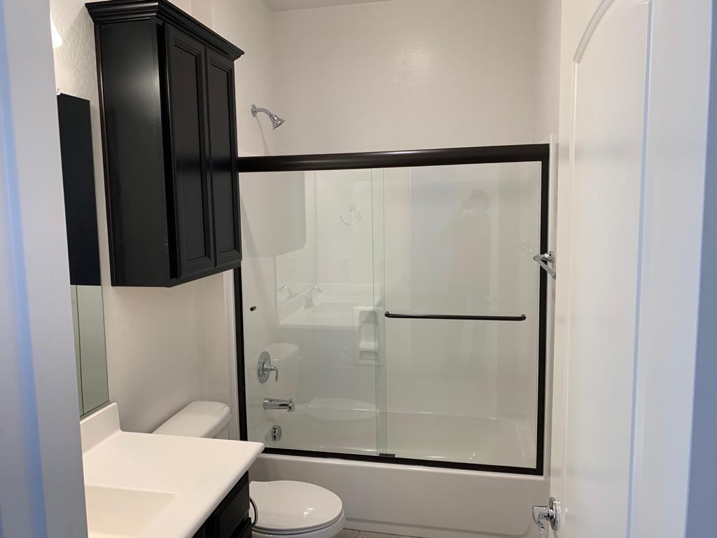 3900 East Baseline Road, Unit 118 Phoenix, AZ 85042 - Photo 7 of 32 a bathroom with a shower and a toilet
