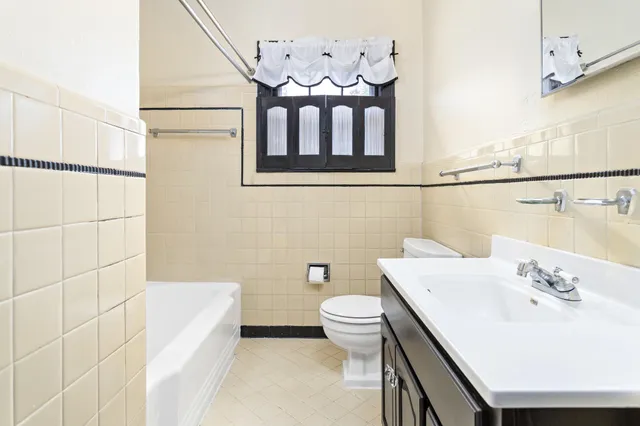 a bathroom with a sink a toilet and a bathtub