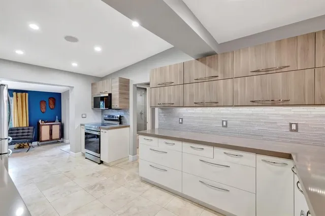 a bed room with a bed and a ceiling fan