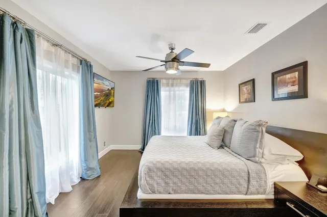 a view of a dining room with furniture wooden floor and chandelier