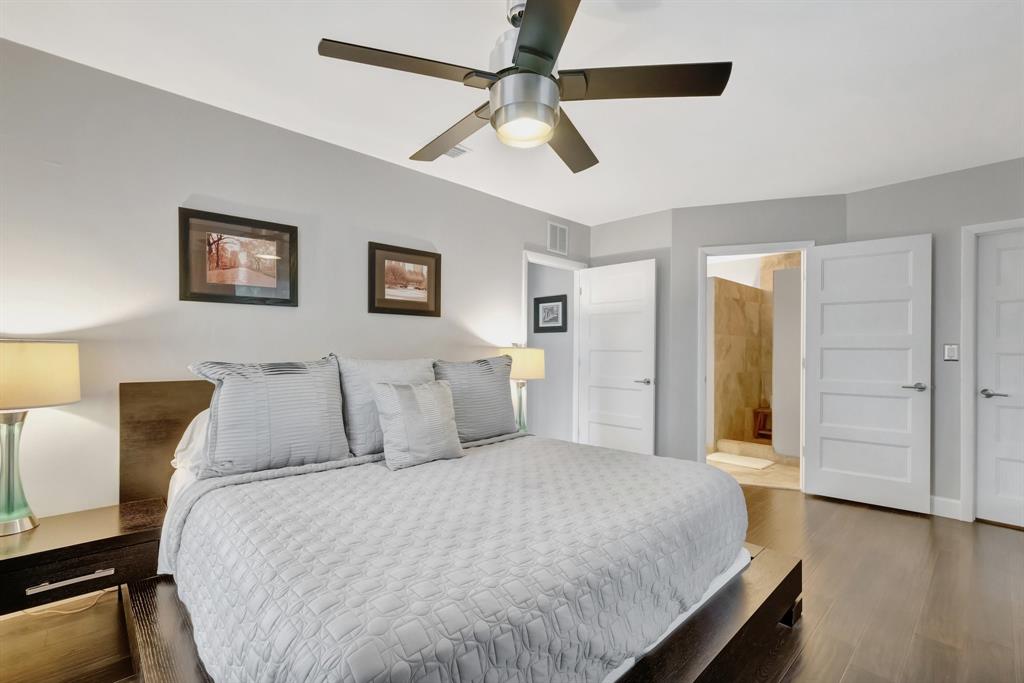 201 Northeast 28th Court Wilton Manors, FL 33334 - Photo 24 of 83 a bed room with a bed and a ceiling fan