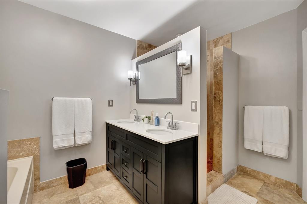 201 Northeast 28th Court Wilton Manors, FL 33334 - Photo 27 of 83 a bathroom with a sink a toilet and a mirror