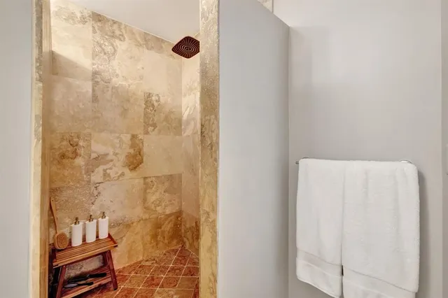 a view of a backyard with plants and a patio