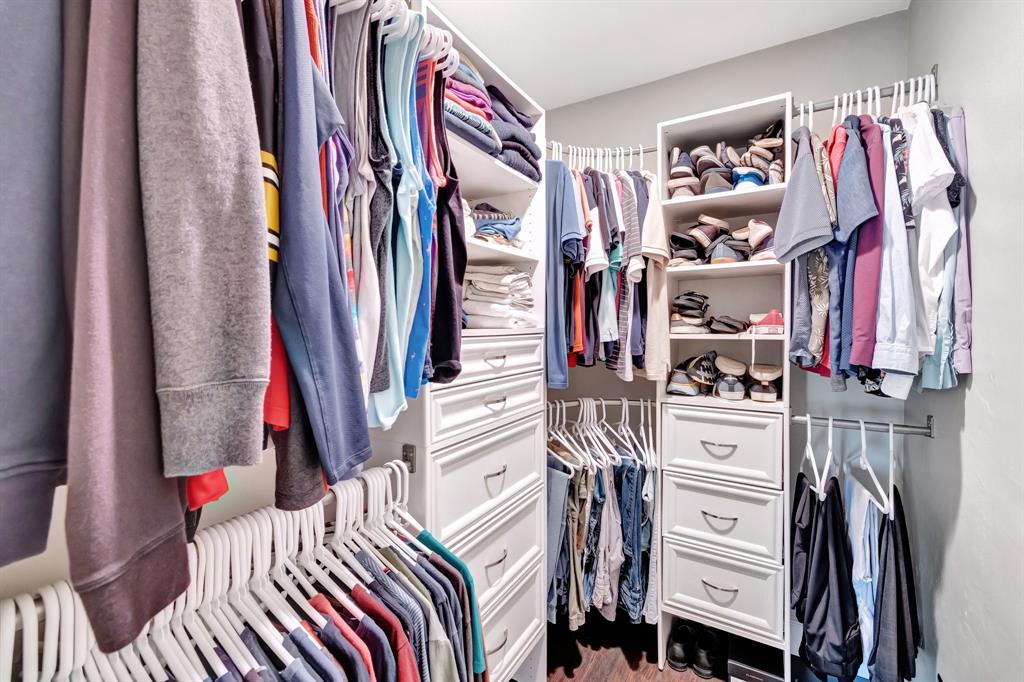 201 Northeast 28th Court Wilton Manors, FL 33334 - Photo 30 of 83 a view of walk in closet with clothes and shoes