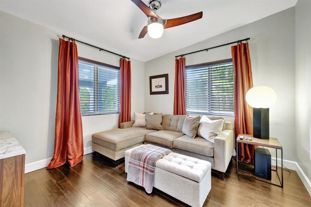 201 Northeast 28th Court Wilton Manors, FL 33334 - Photo 32 of 83 a living room with furniture and a window