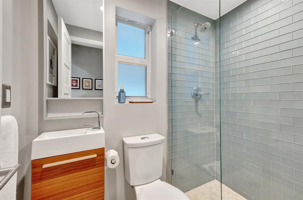 201 Northeast 28th Court Wilton Manors, FL 33334 - Photo 34 of 83 a bathroom with a toilet and a shower