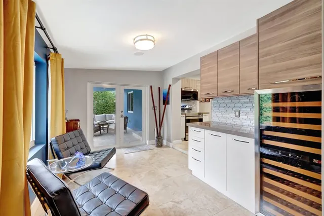 an aerial view of residential houses with city view