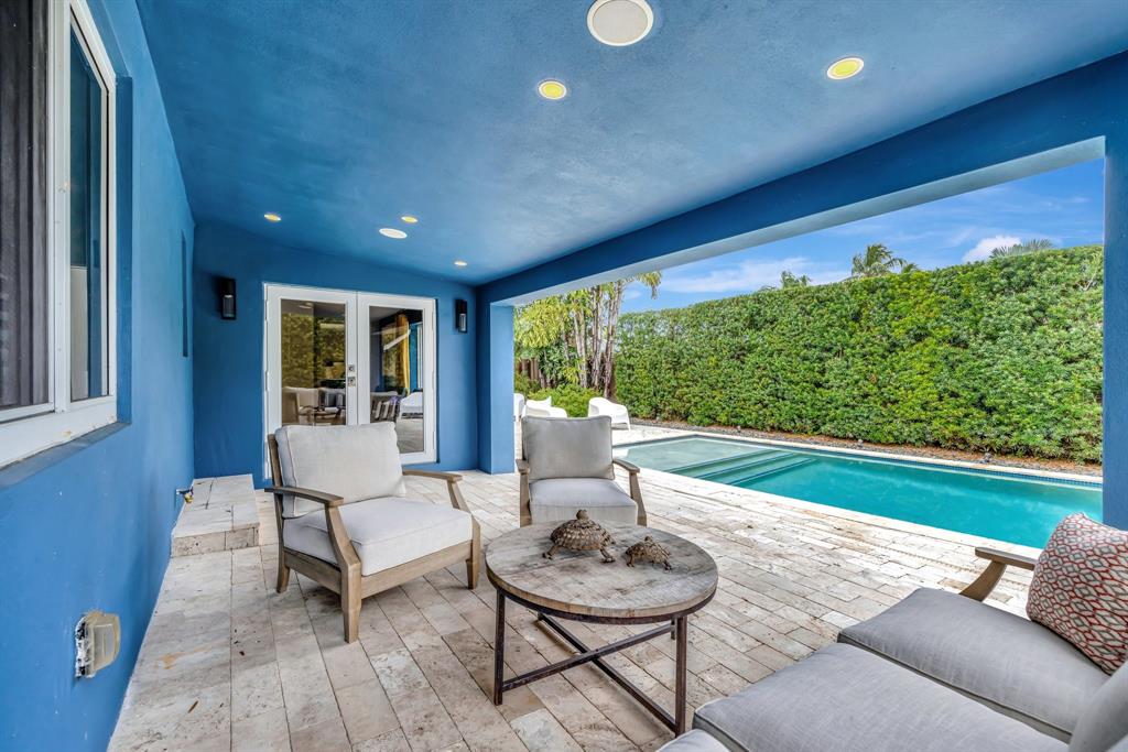 201 Northeast 28th Court Wilton Manors, FL 33334 - Photo 49 of 83 a living room with furniture and a large window