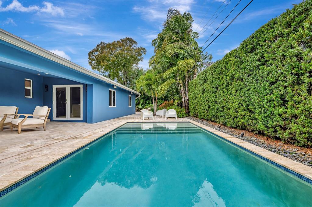 201 Northeast 28th Court Wilton Manors, FL 33334 - Photo 52 of 83 a view of a backyard with plants and a patio