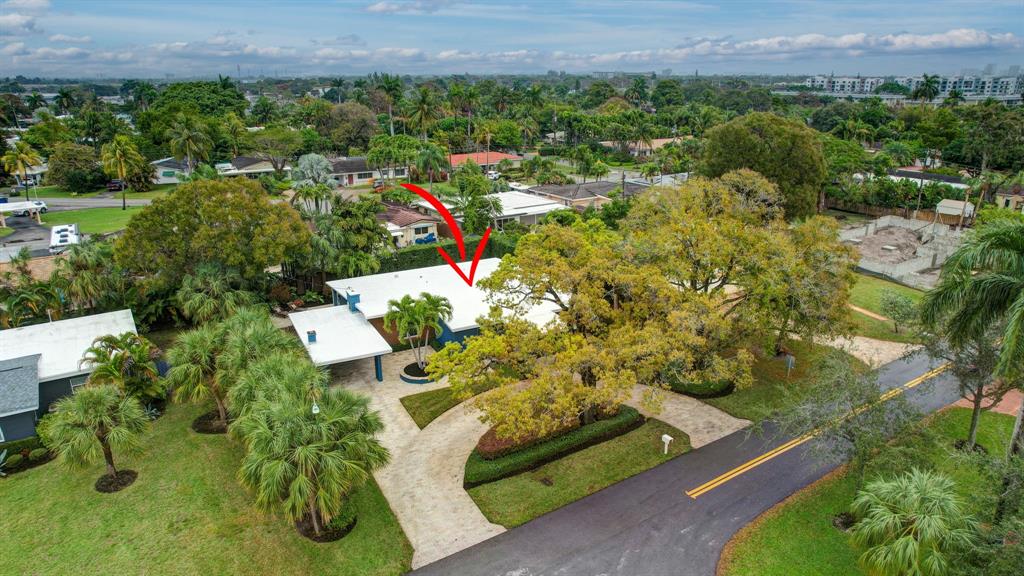 201 Northeast 28th Court Wilton Manors, FL 33334 - Photo 64 of 83 an aerial view of a residential houses with outdoor space and trees all around