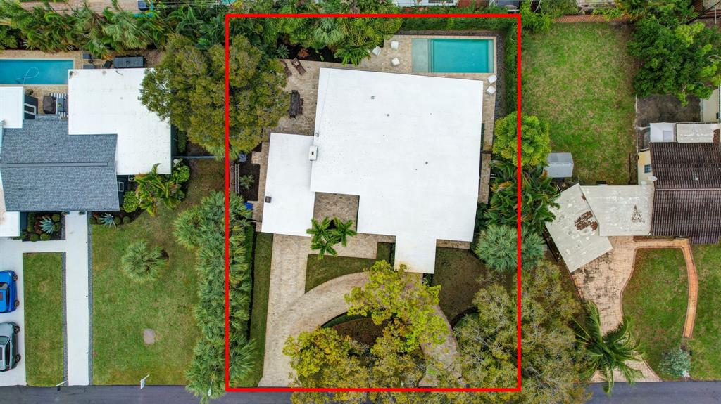 201 Northeast 28th Court Wilton Manors, FL 33334 - Photo 77 of 83 an aerial view of a house with a yard and large tree