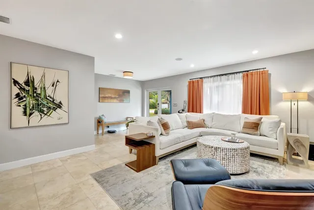 a kitchen with stainless steel appliances a refrigerator sink and cabinets