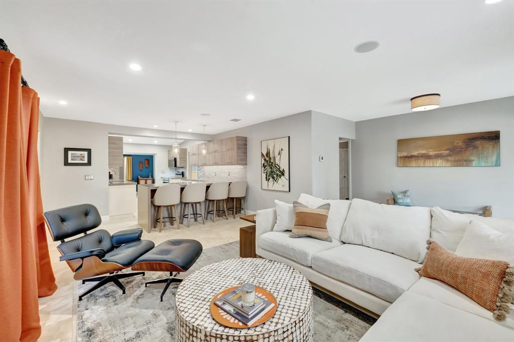 201 Northeast 28th Court Wilton Manors, FL 33334 - Photo 9 of 83 a living room with furniture a rug and a window