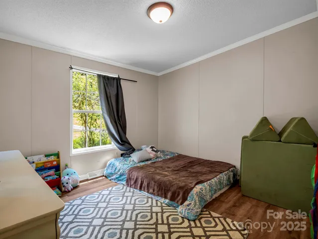 a bedroom with a bed and cabinets