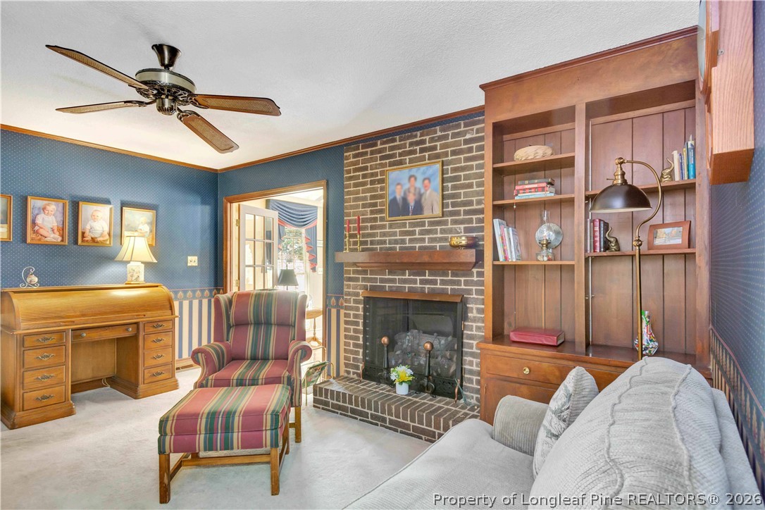 5219 McLeod Road Lumberton, NC 28358 - Photo 12 of 33 a living room with furniture and a fireplace