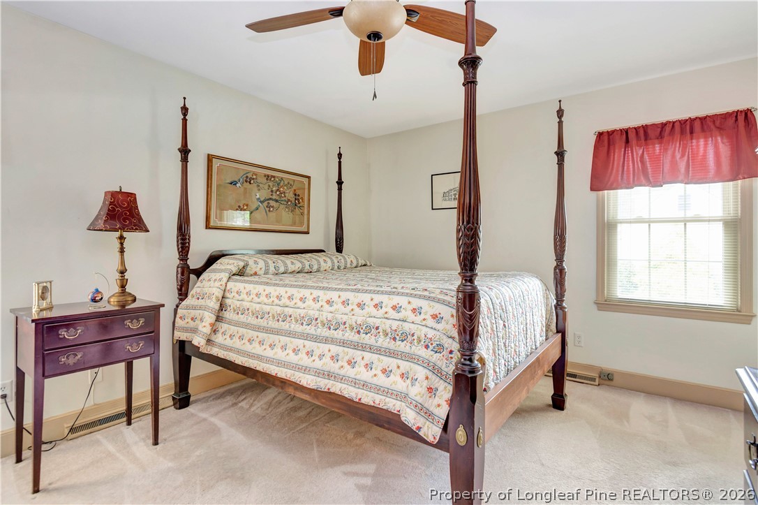 5219 McLeod Road Lumberton, NC 28358 - Photo 16 of 33 a bedroom with a bed and a table