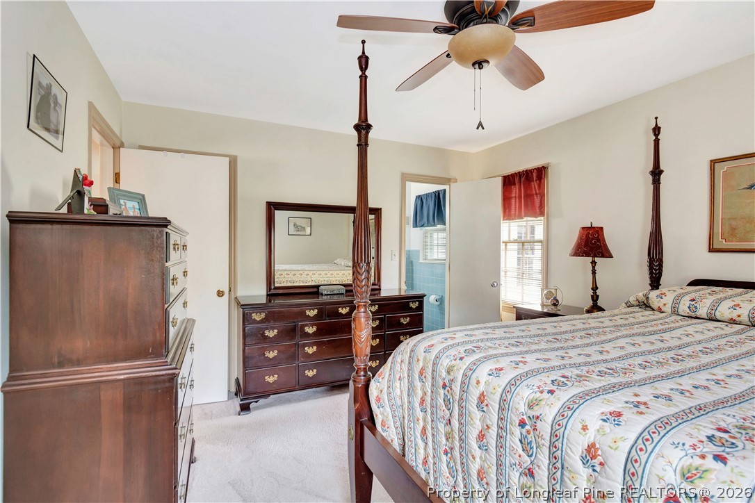 5219 McLeod Road Lumberton, NC 28358 - Photo 17 of 33 a bedroom with a bed and wooden floor