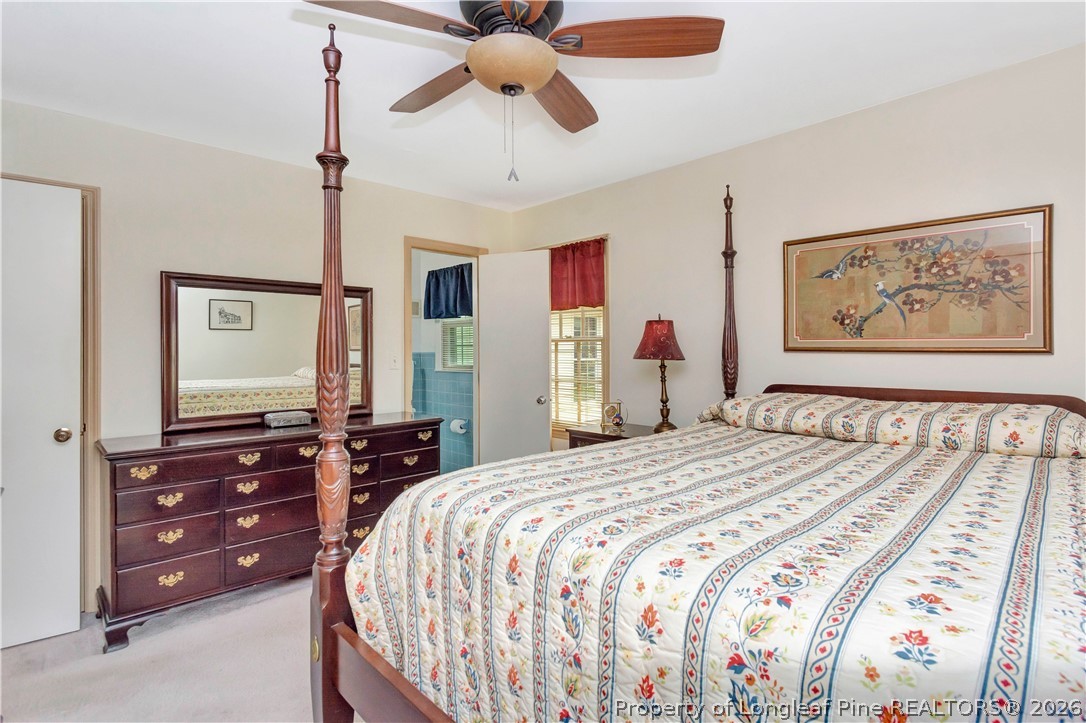 5219 McLeod Road Lumberton, NC 28358 - Photo 18 of 33 a bedroom with a bed and dresser