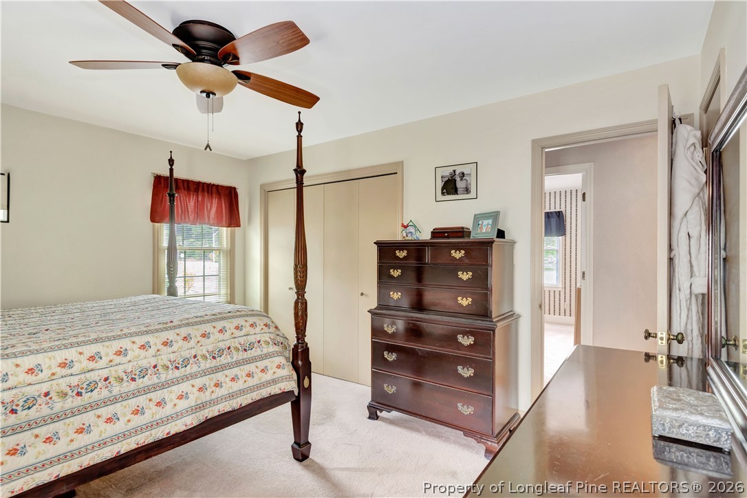 5219 McLeod Road Lumberton, NC 28358 - Photo 19 of 33 a bedroom with a bed and a dresser