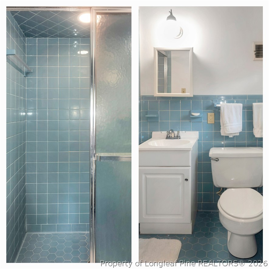 5219 McLeod Road Lumberton, NC 28358 - Photo 22 of 33 a bathroom with a toilet sink and mirror