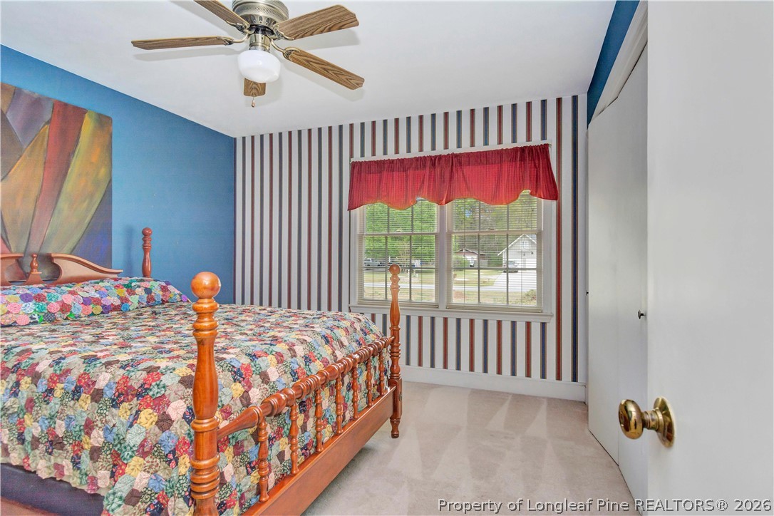 5219 McLeod Road Lumberton, NC 28358 - Photo 23 of 33 a bed sitting in a bedroom next to a window