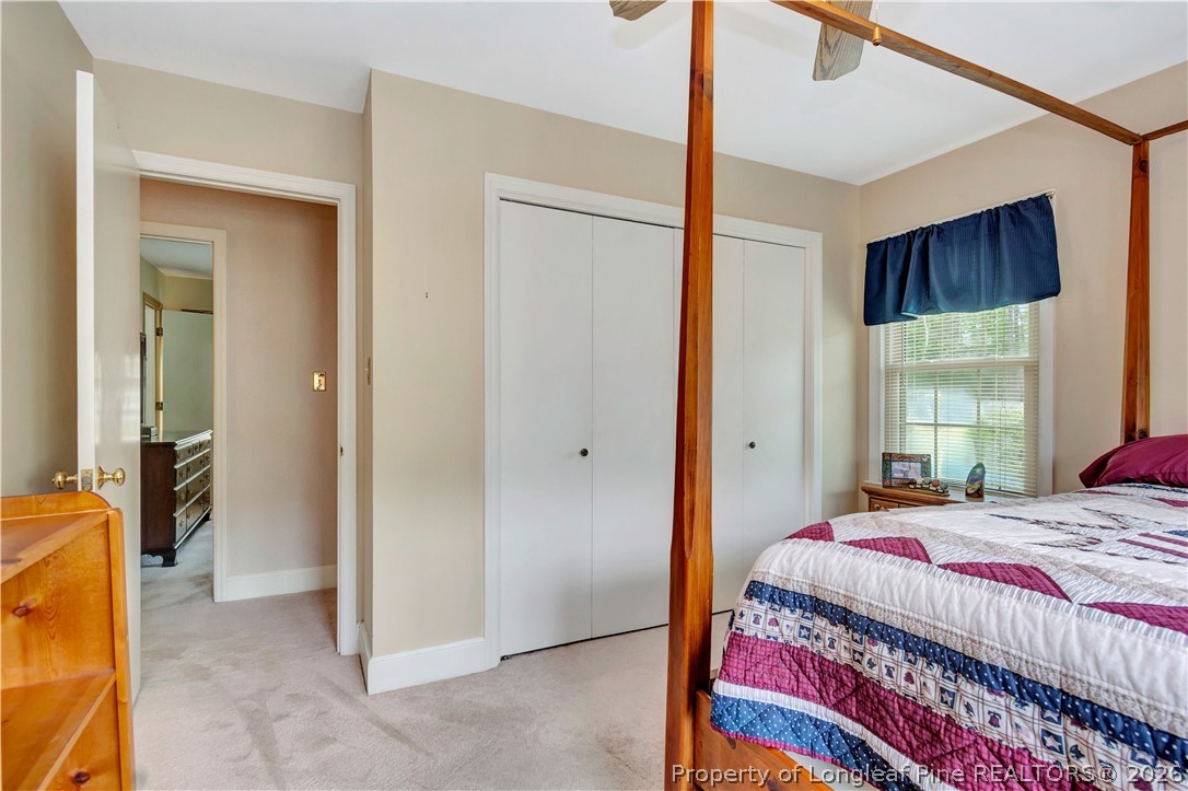 5219 McLeod Road Lumberton, NC 28358 - Photo 26 of 33 a bedroom with a bed and a painting on the wall