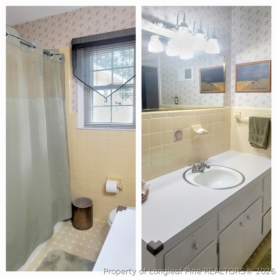 5219 McLeod Road Lumberton, NC 28358 - Photo 28 of 33 a bathroom with a sink and a mirror