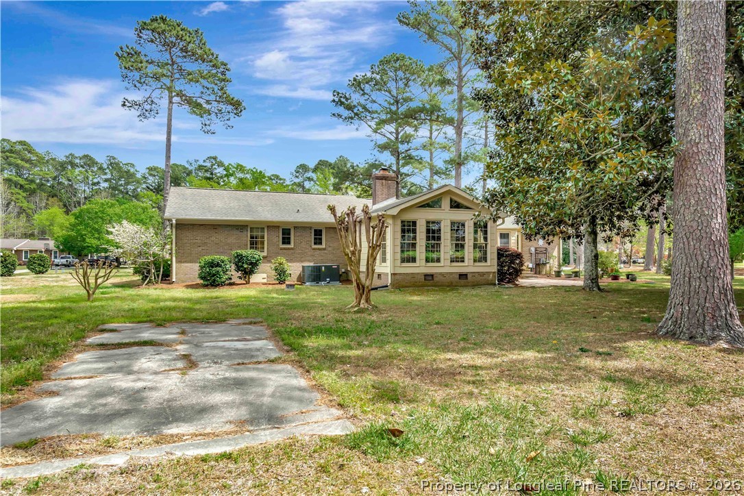 5219 McLeod Road Lumberton, NC 28358 - Photo 30 of 33 a front view of a house with a yard