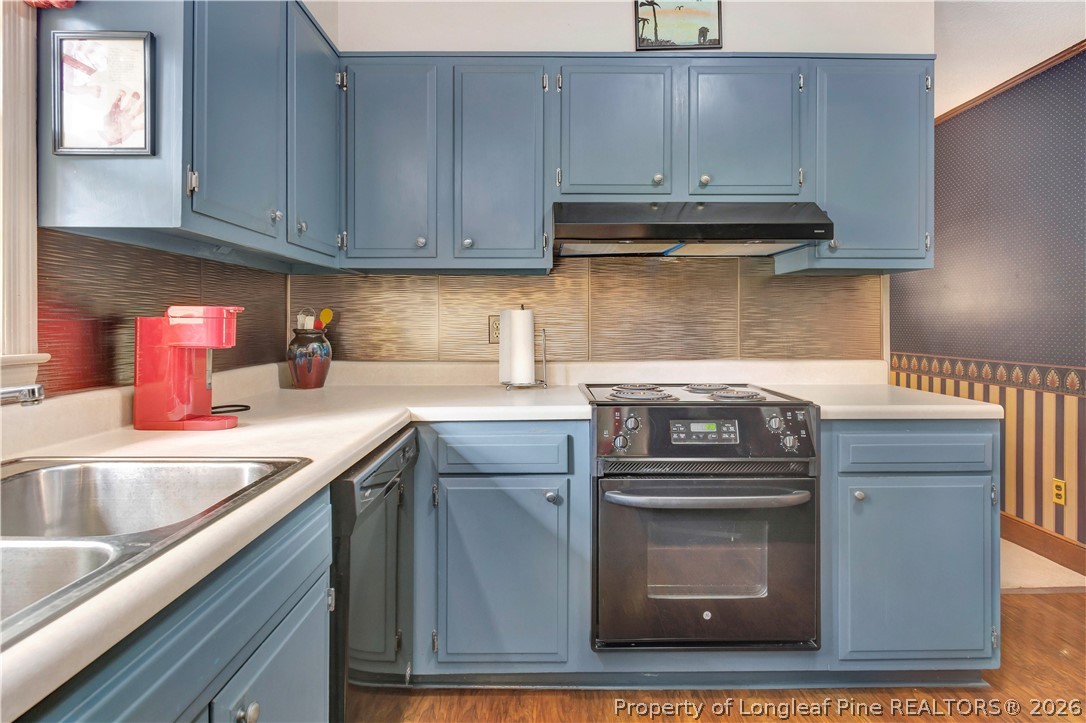 5219 McLeod Road Lumberton, NC 28358 - Photo 7 of 33 a kitchen with stainless steel appliances granite countertop a sink stove and cabinets