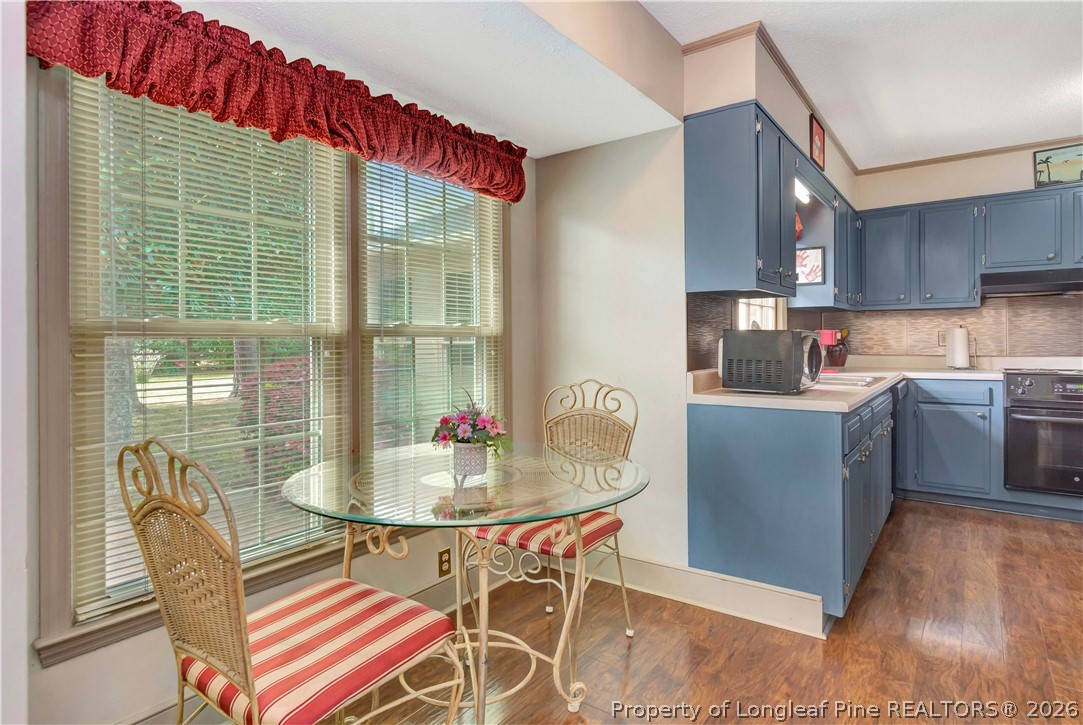 5219 McLeod Road Lumberton, NC 28358 - Photo 9 of 33 a dining room with furniture and a floor to ceiling window