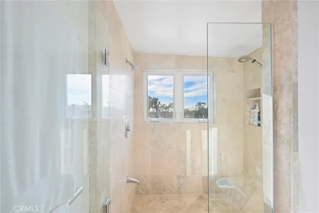 a bed room with a bed and a large window