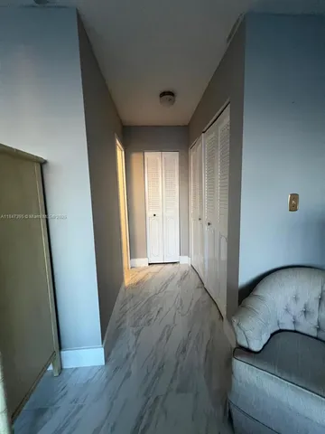 a bedroom with a bed and a mirror