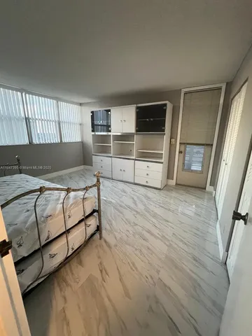 a bathroom with a double vanity sink toilet and shower