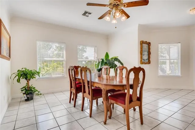 a dining room with furniture and window