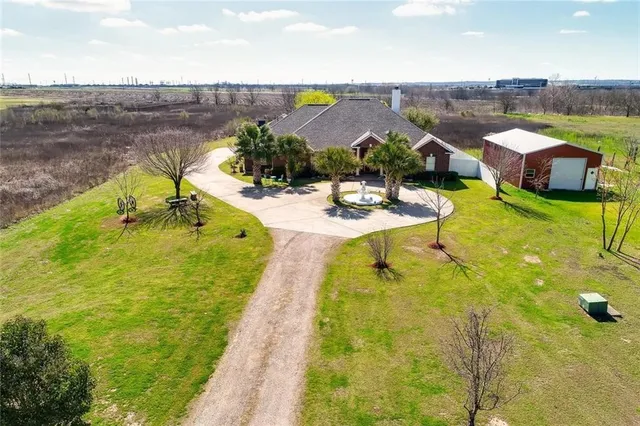 a view of a swimming pool with a yard