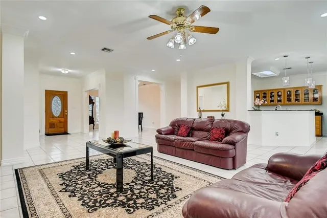 a living room with furniture and a rug