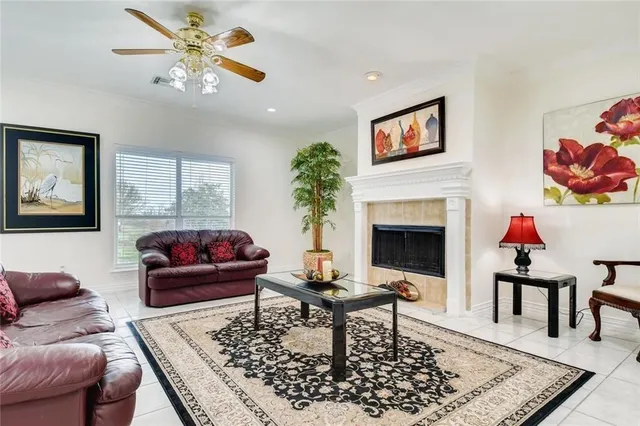 a living room with furniture and a fireplace