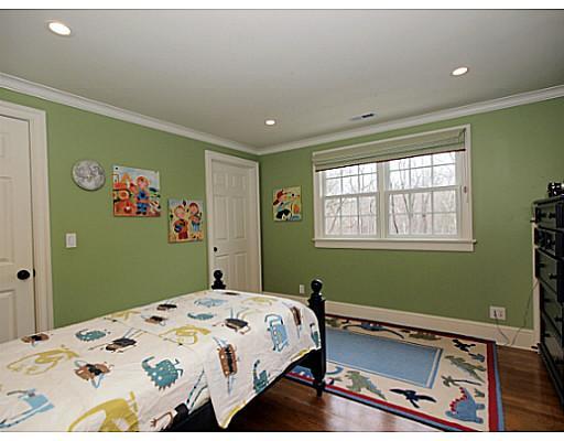 49 Pecksland Road Greenwich, CT 06831 - Photo 14 of 18 a bedroom with a bed and a window