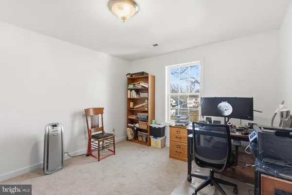 a view of a workspace with furniture