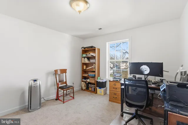 a view of a workspace with furniture