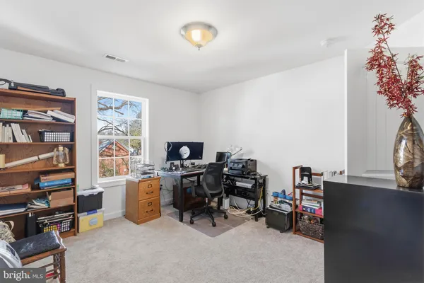 a view of a workspace with furniture