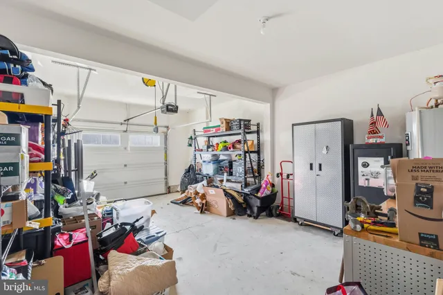 a view of yard covered with snow in front of house
