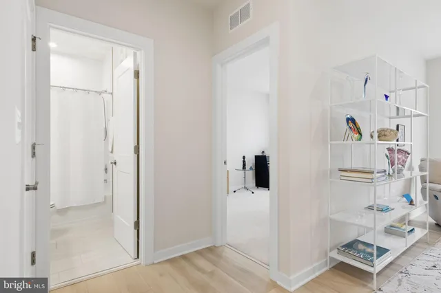 a patio with a table and chairs under an umbrella