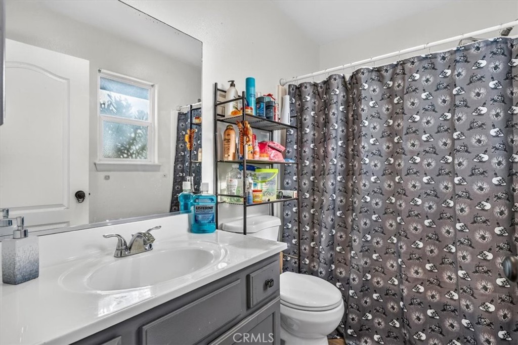 13146 Mohawk Road Apple Valley, CA 92308 - Photo 12 of 15 a bathroom with a sink and a toilet
